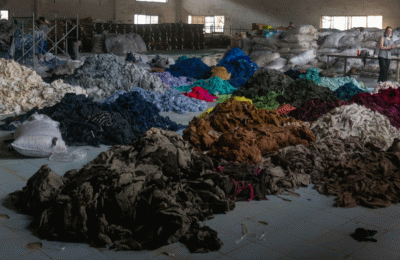 Image of piles of discarded apparel for textile-to-textile recycling.