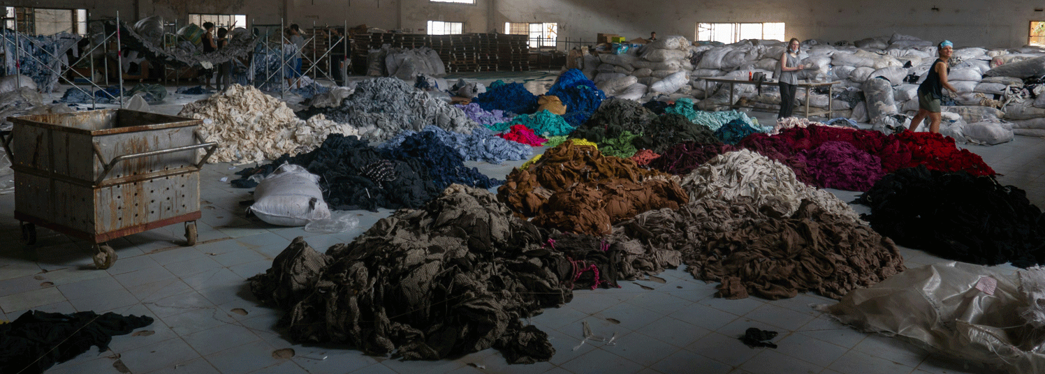 Image of piles of discarded apparel for textile-to-textile recycling.