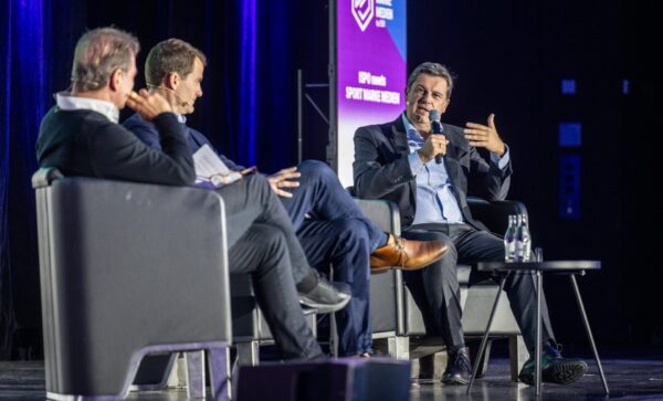 Panel discussion on stage in front of an audience